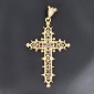 Pendentif  religieux en forme de croix ajourée et bordée de motifs en or jaune 750 ‰  - B10306