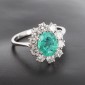 Bague pompadour en or blanc 750 ‰  émeraude ovale de zambie de 1,60 ct entourée d'un rang de 10 diamants pour 1 ct env - B10526